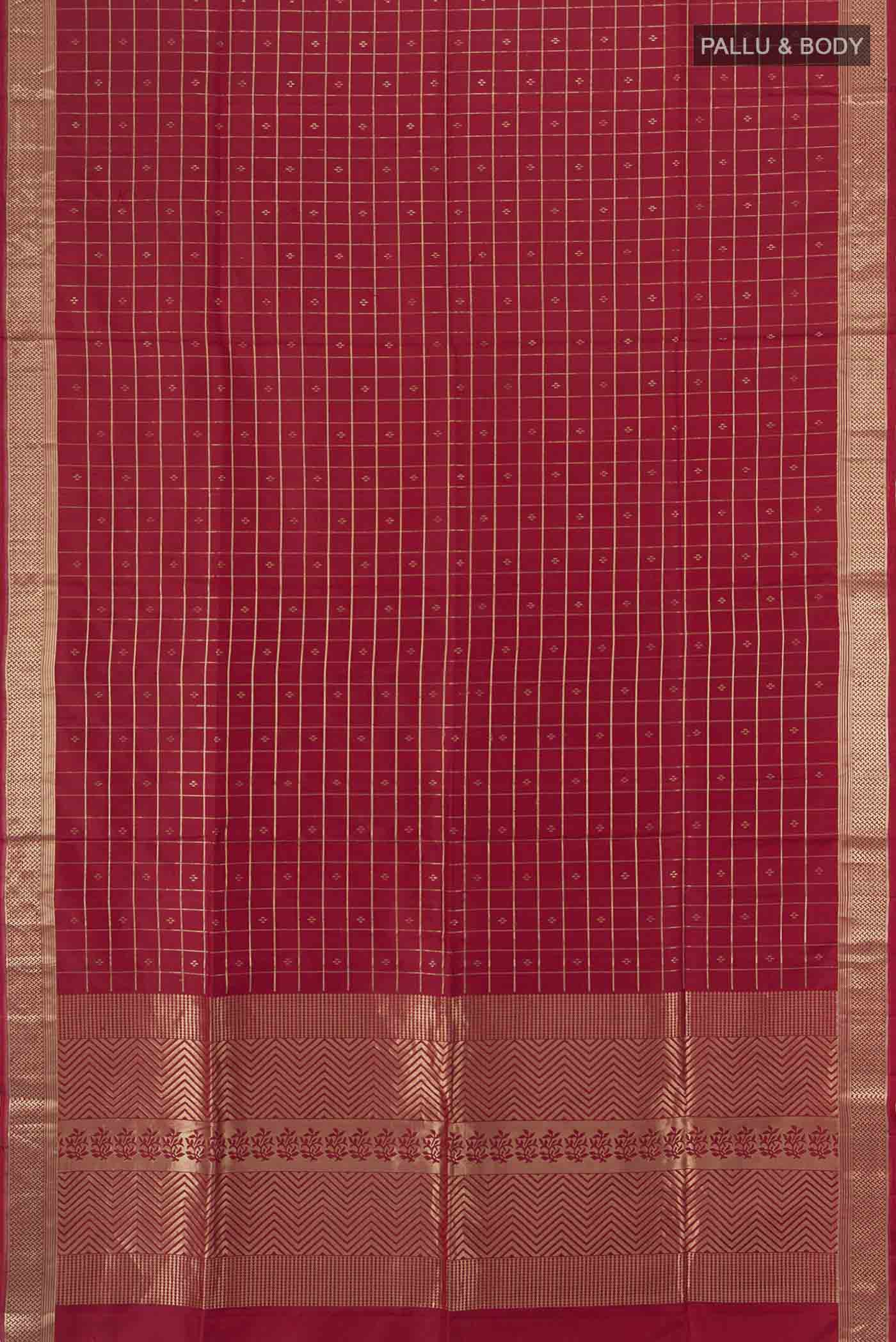 Flat view of Maroon Soft Silk Saree with Zari Butta on the body and Silk Border. 