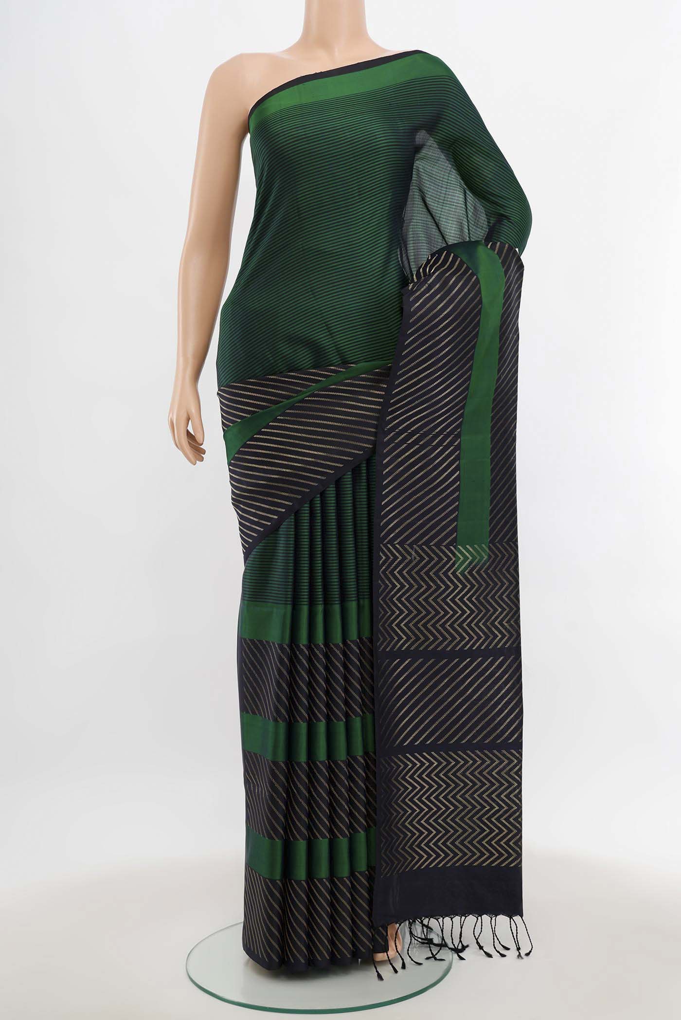 Multi Color Soft Silk Saree with Zari Butta on the body and Silk Border.  displayed on a mannequin