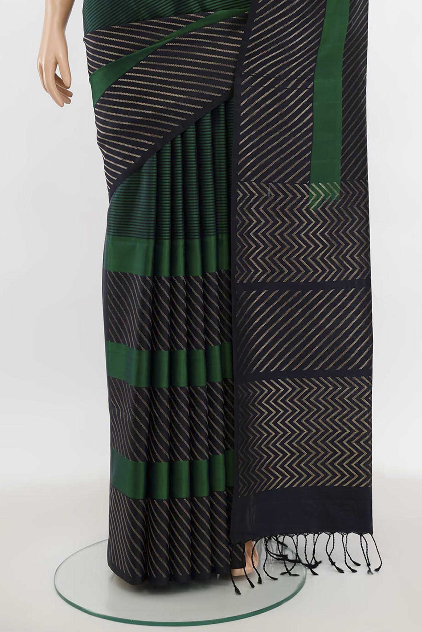 Pleats and pallu of Multi Color Soft Silk Saree with Zari Butta on the body and Silk Border. 