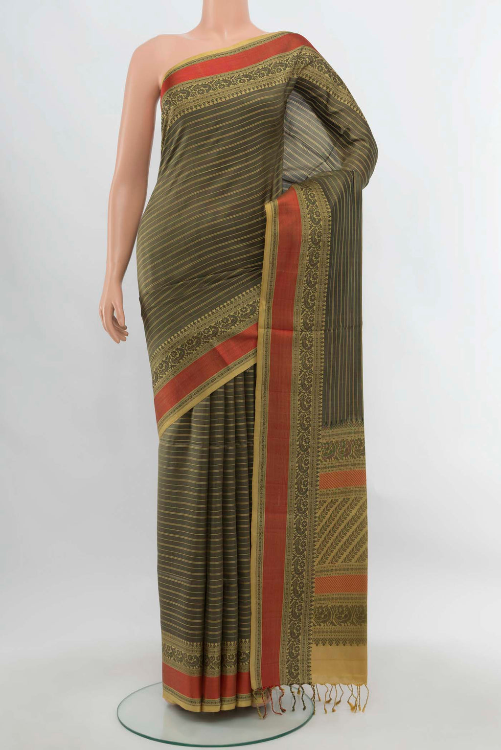 Black Soft Silk Saree with Zari Butta on the body and Silk Border.  displayed on a mannequin