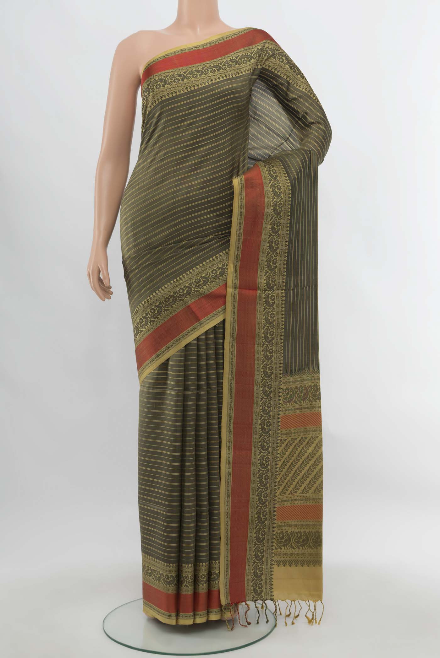 Black Soft Silk Saree with Zari Butta on the body and Silk Border.  displayed on a mannequin