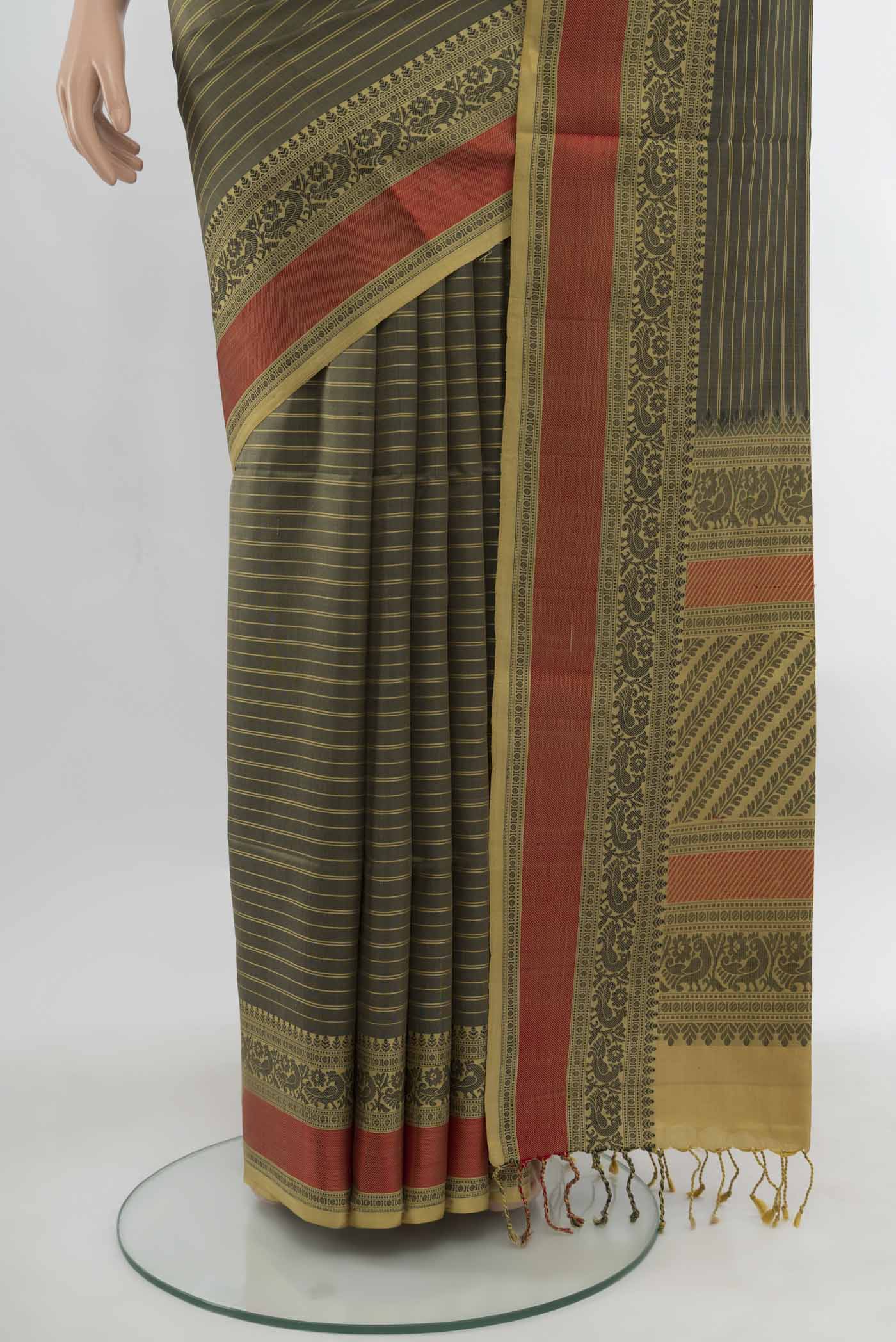 Pleats and pallu of Black Soft Silk Saree with Zari Butta on the body and Silk Border. 