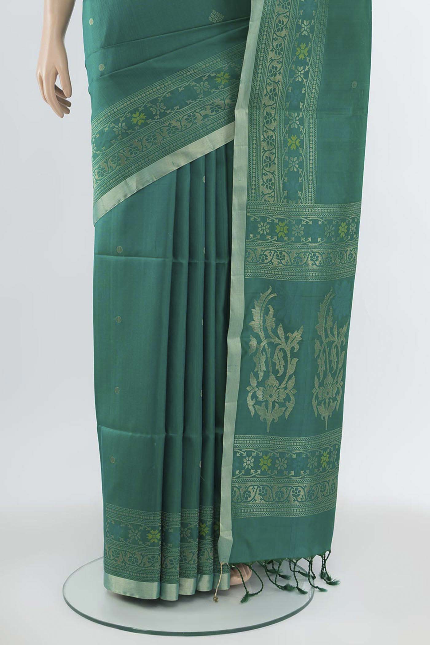 Pleats and pallu of Light Green Soft Silk Saree with Zari Butta on the body and Silk Border. 