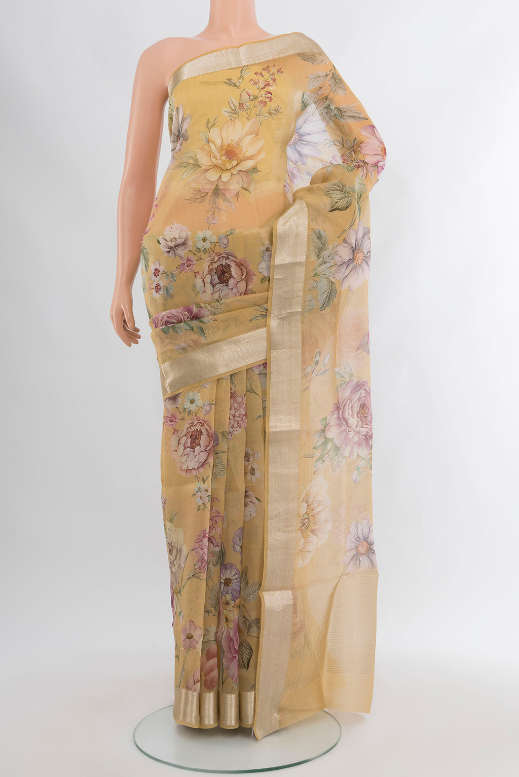 Sandal Organza Silk Saree with Floral Print on the body and Zari Border.  displayed on a mannequin
