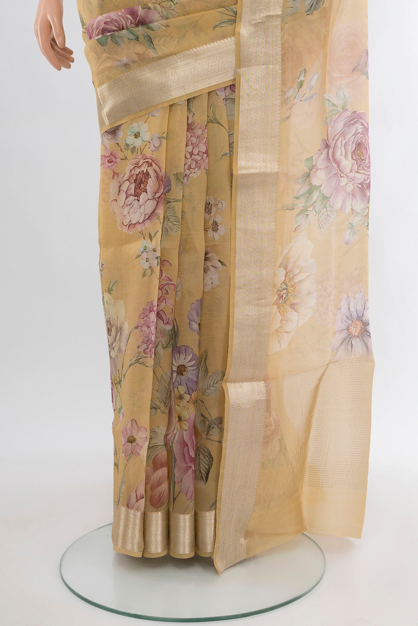 Pleats and pallu of Sandal Organza Silk Saree with Floral Print on the body and Zari Border. 