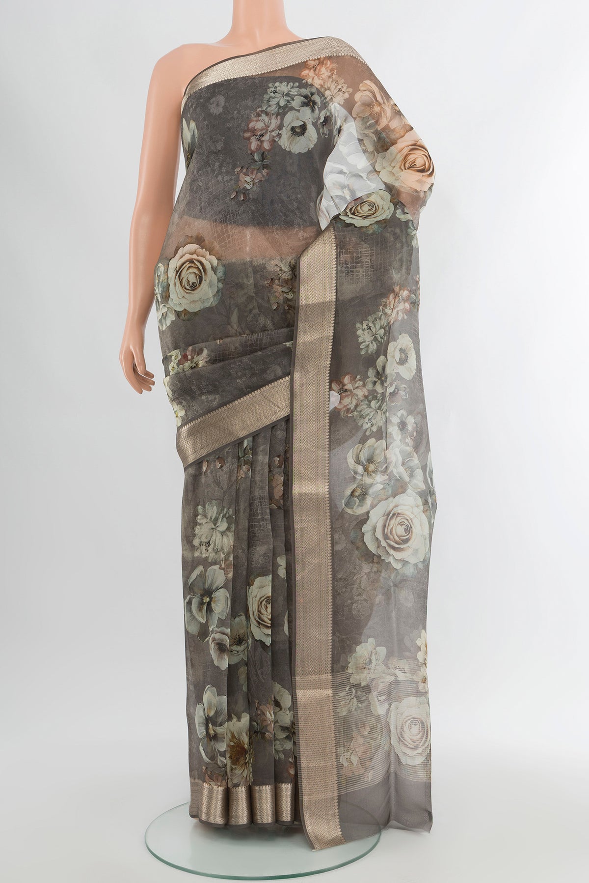 Davys Grey Organza Silk Saree with Floral Print on the body and Zari Border.  displayed on a mannequin