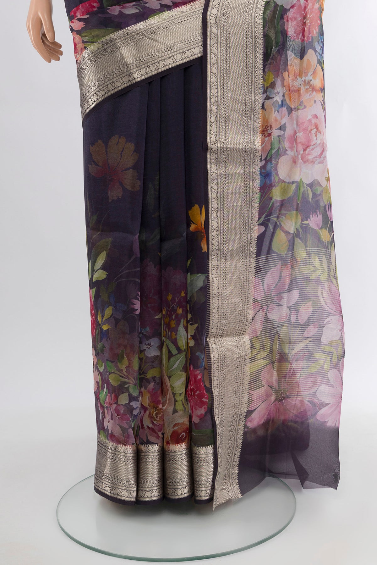 Pleats and pallu of Navy Blue Organza Silk Saree with Floral Print on the body and Zari Border. 