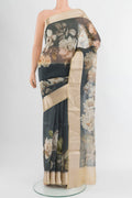 Grey Organza Silk Saree with Floral Print on the body and Zari Border.  displayed on a mannequin