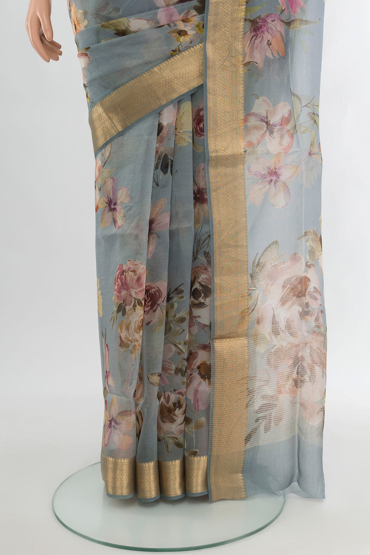 Pleats and pallu of Davys Grey Organza Silk Saree with Floral Print on the body and Zari Border. 