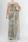 Light Blue Organza Silk Saree with Floral Print on the body and Zari Border.  displayed on a mannequin