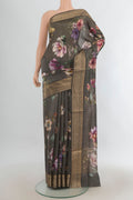 Green Tussar Saree with Floral Print on the body and Zari Border.  displayed on a mannequin