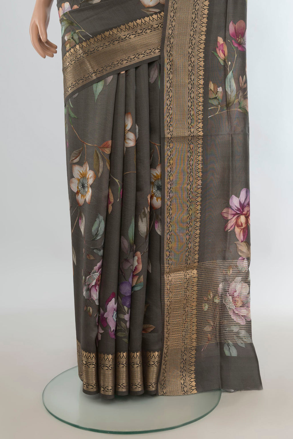 Pleats and pallu of Green Tussar Saree with Floral Print on the body and Zari Border. 