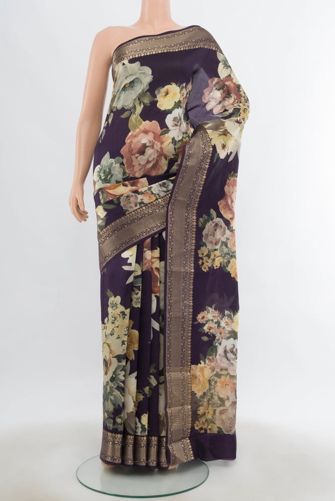 Navy Blue Banarasi Silk Saree with Floral Print on the body and Fancy Border.  displayed on a mannequin