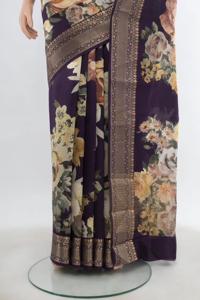 Pleats and pallu of Navy Blue Banarasi Silk Saree with Floral Print on the body and Fancy Border. 