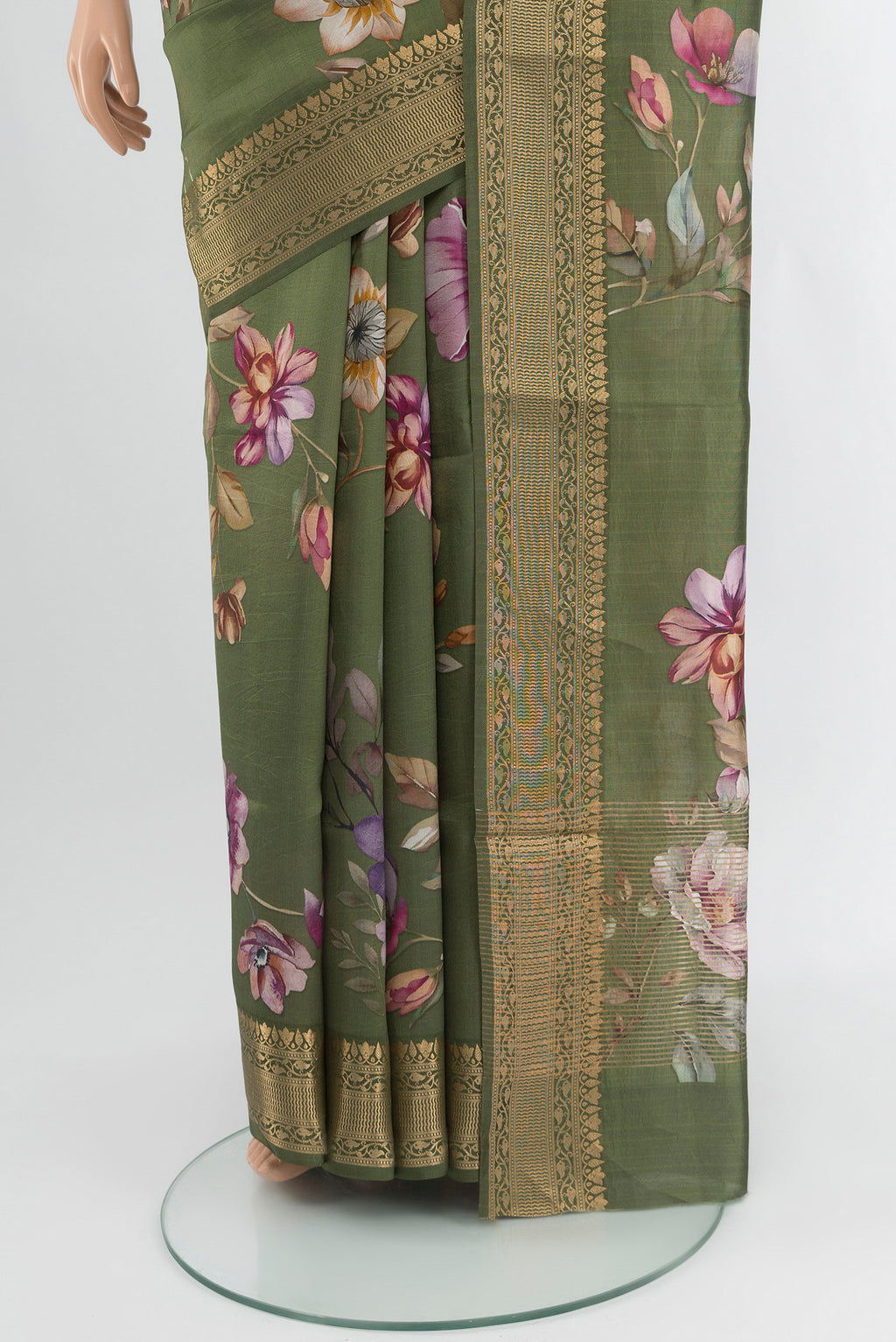 Pleats and pallu of Olive Green Banarasi Katan Silk Saree with Floral Print on the body and Zari Border. 