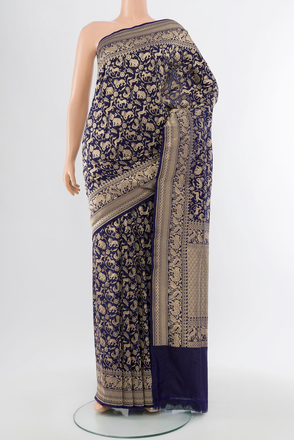 Navy Blue Banarasi Silk Saree with Zari Butta on the body and Silk Border.  displayed on a mannequin