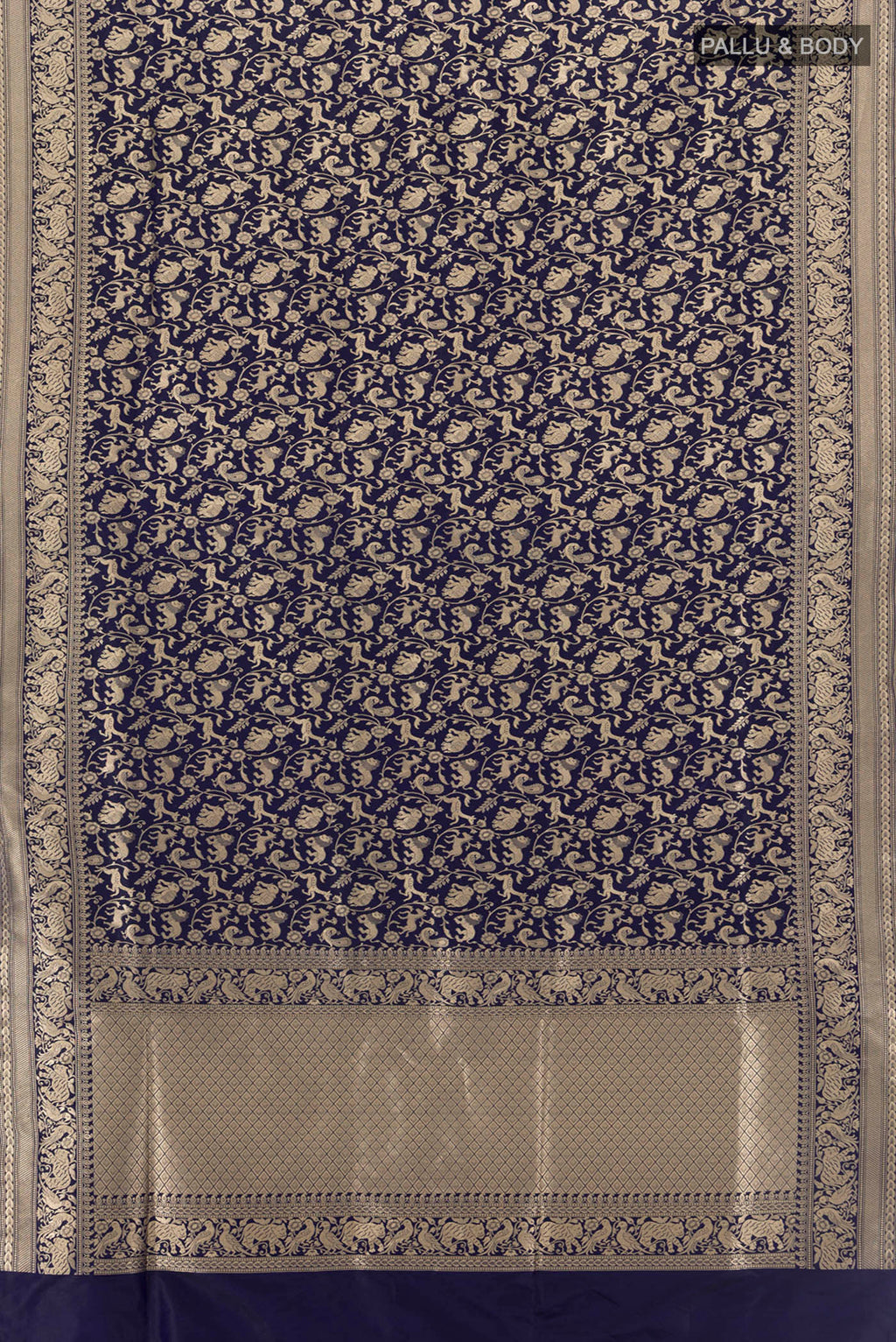 Flat view of Navy Blue Banarasi Silk Saree with Zari Butta on the body and Silk Border. 