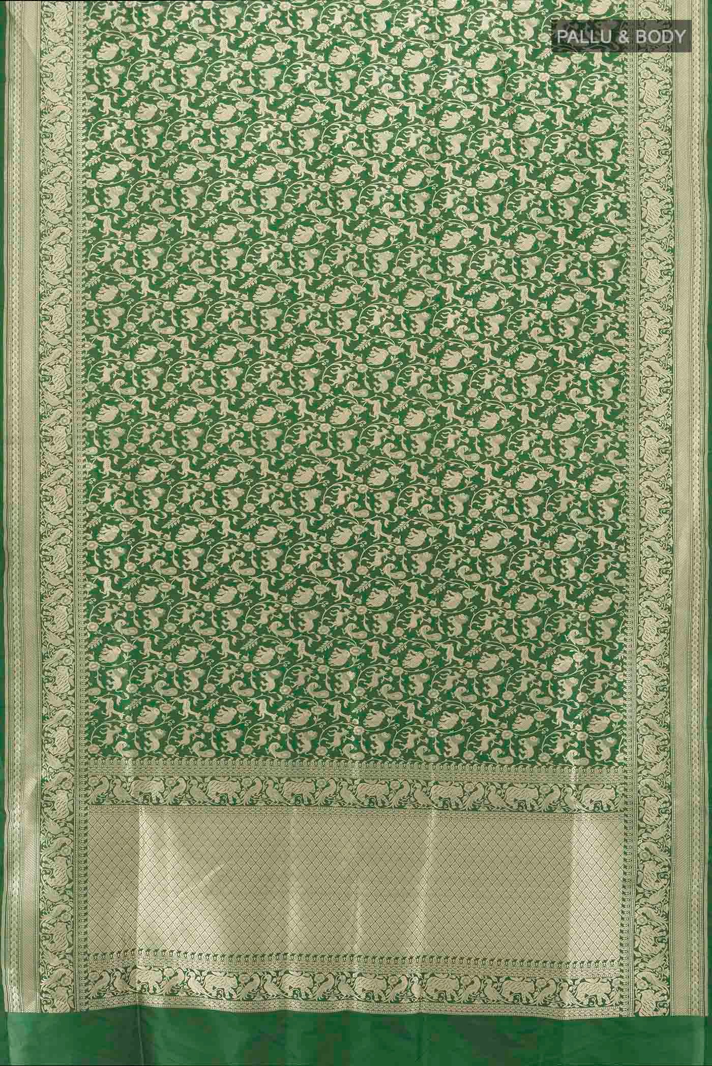 Flat view of Bottle Green Banarasi Silk Saree with Zari Butta on the body and Silk Border. 