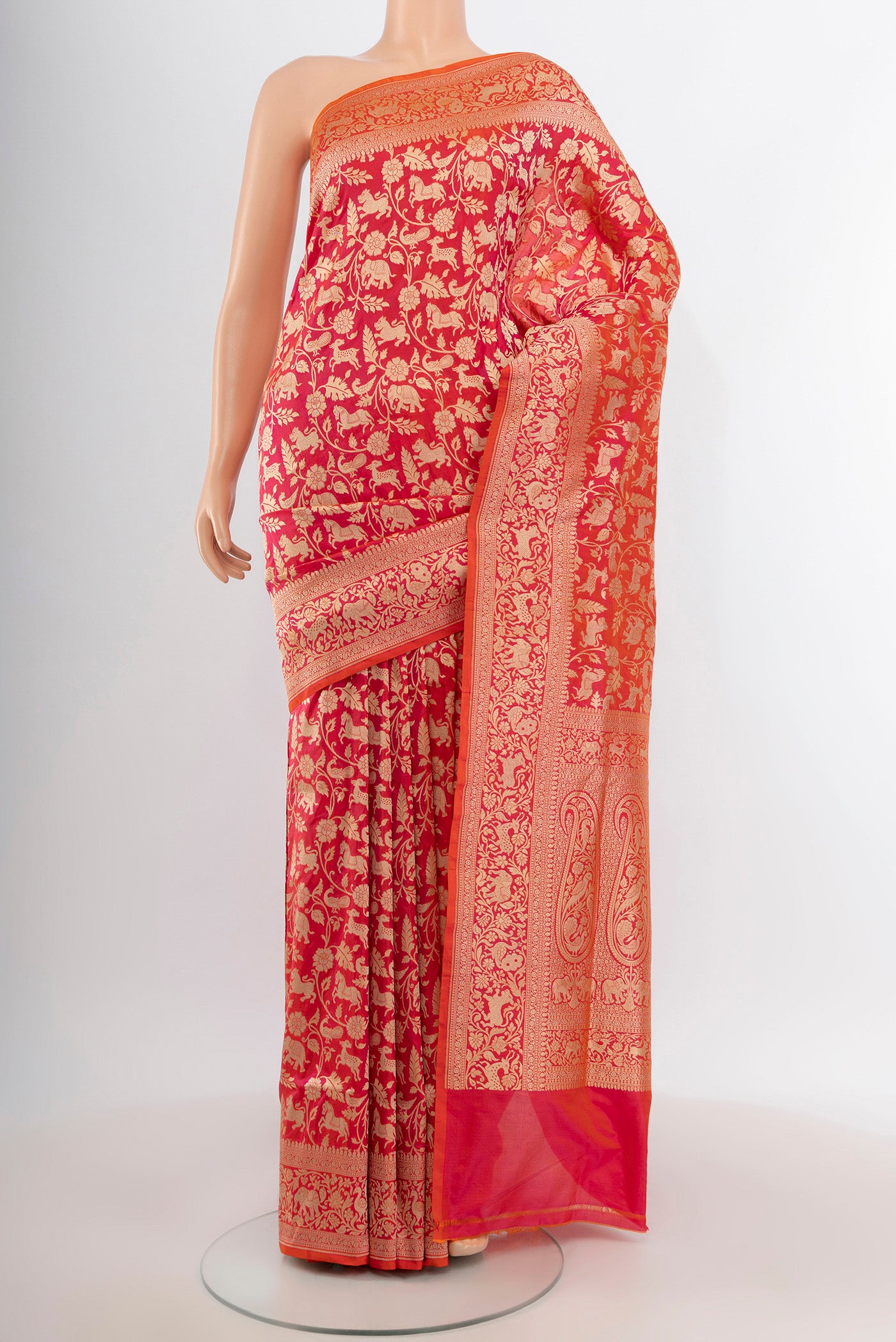 Pink with Orange Color Banarasi Silk Saree with Zari Brocade on the body and Zari Border.  displayed on a mannequin