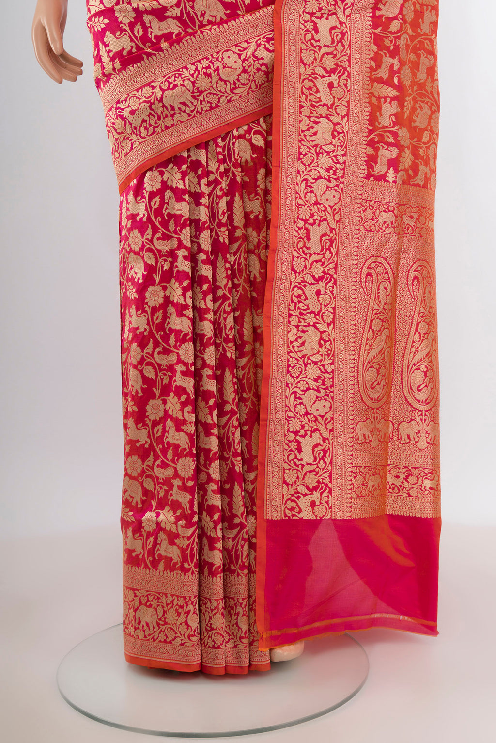 Pleats and pallu of Pink with Orange Color Banarasi Silk Saree with Zari Brocade on the body and Zari Border. 