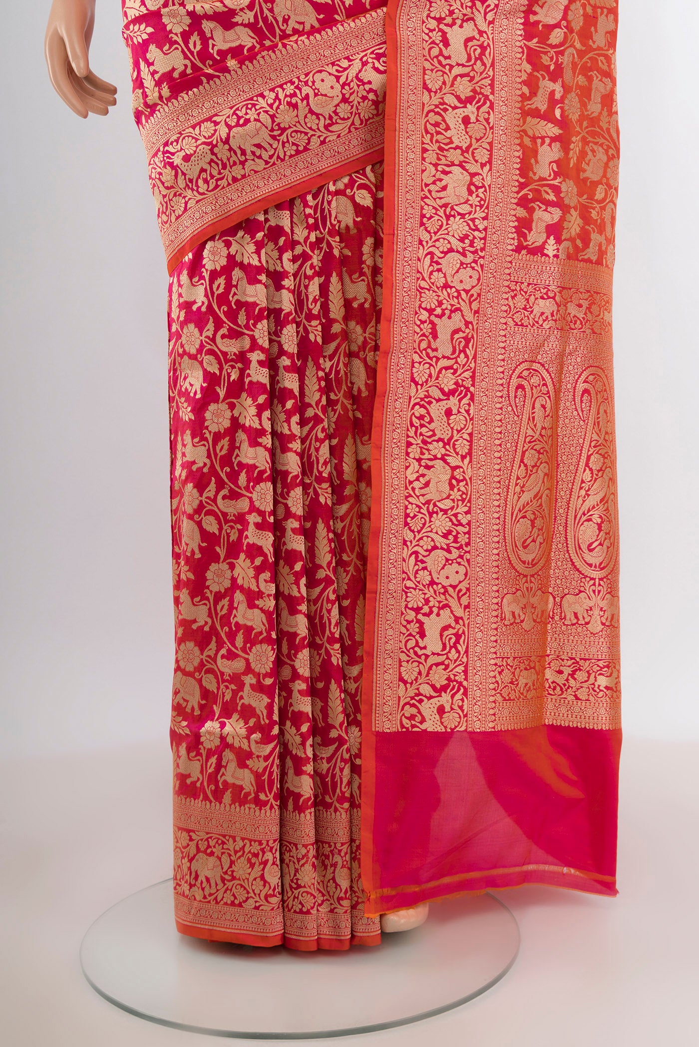 Pleats and pallu of Pink with Orange Color Banarasi Silk Saree with Zari Brocade on the body and Zari Border. 