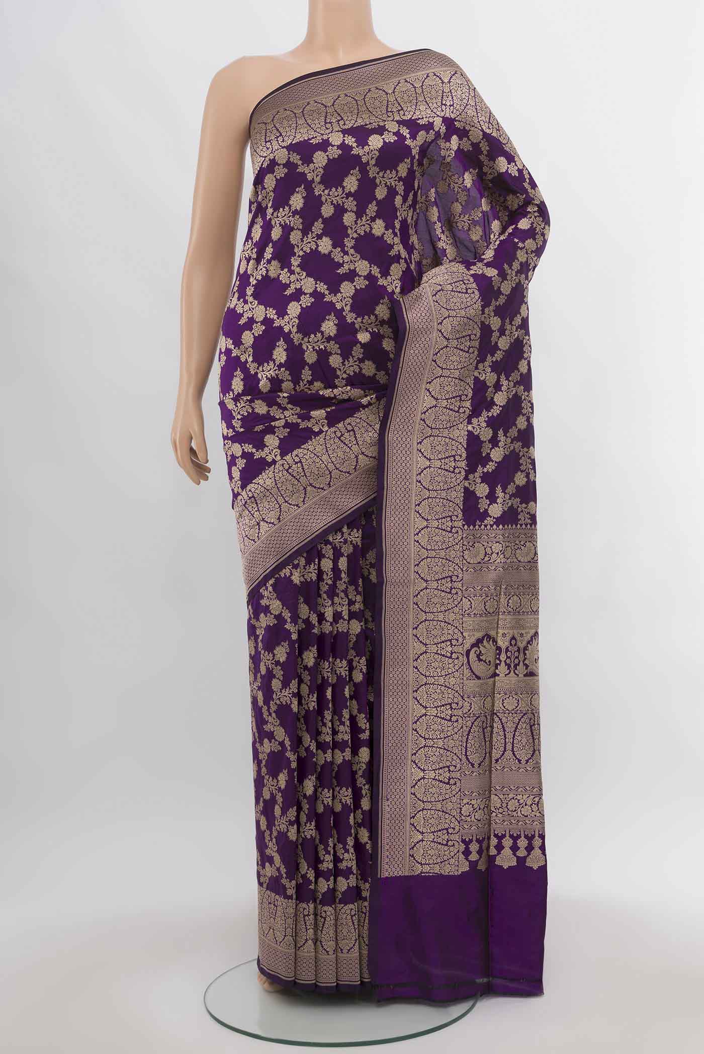 Violet Banarasi Silk Saree with Zari Butta on the body and Silk Border.  displayed on a mannequin