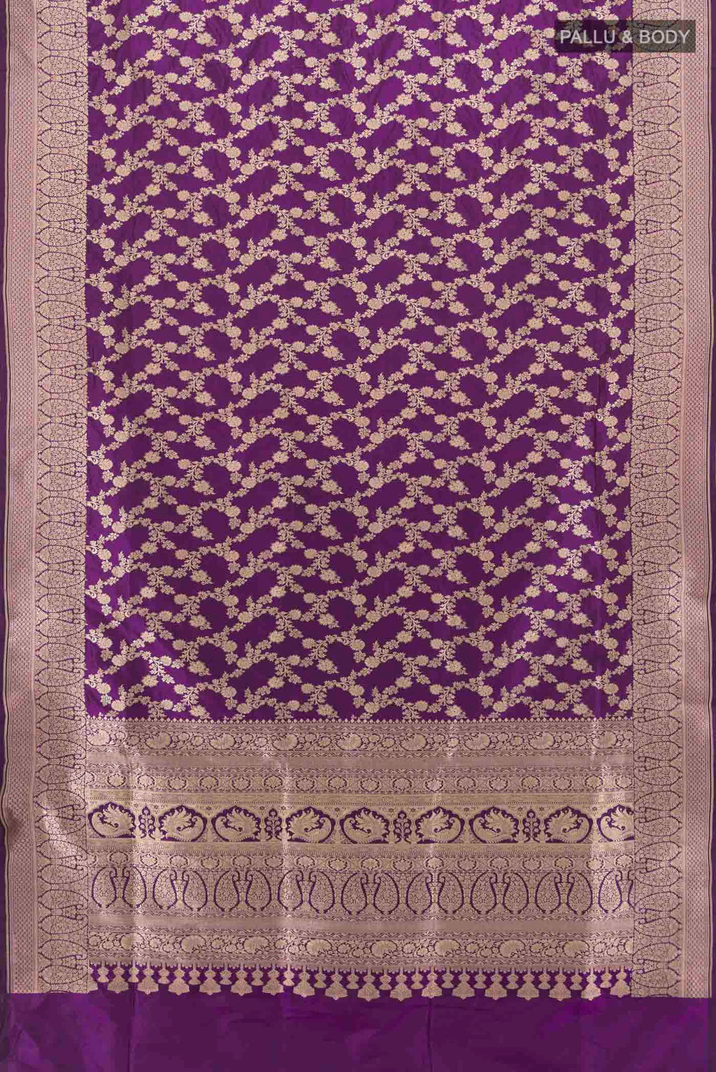 Flat view of Violet Banarasi Silk Saree with Zari Butta on the body and Silk Border. 