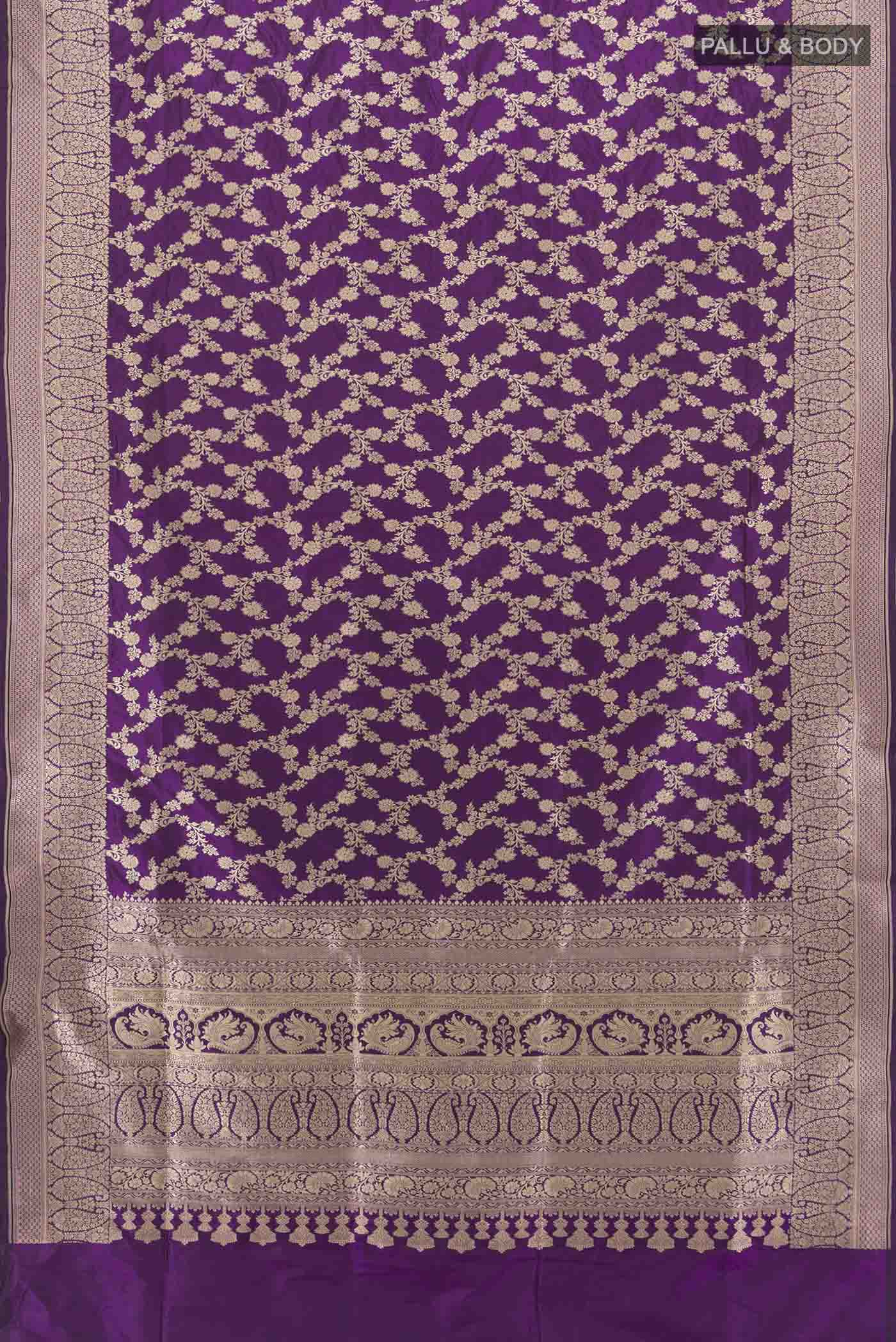 Flat view of Violet Banarasi Silk Saree with Zari Butta on the body and Silk Border. 