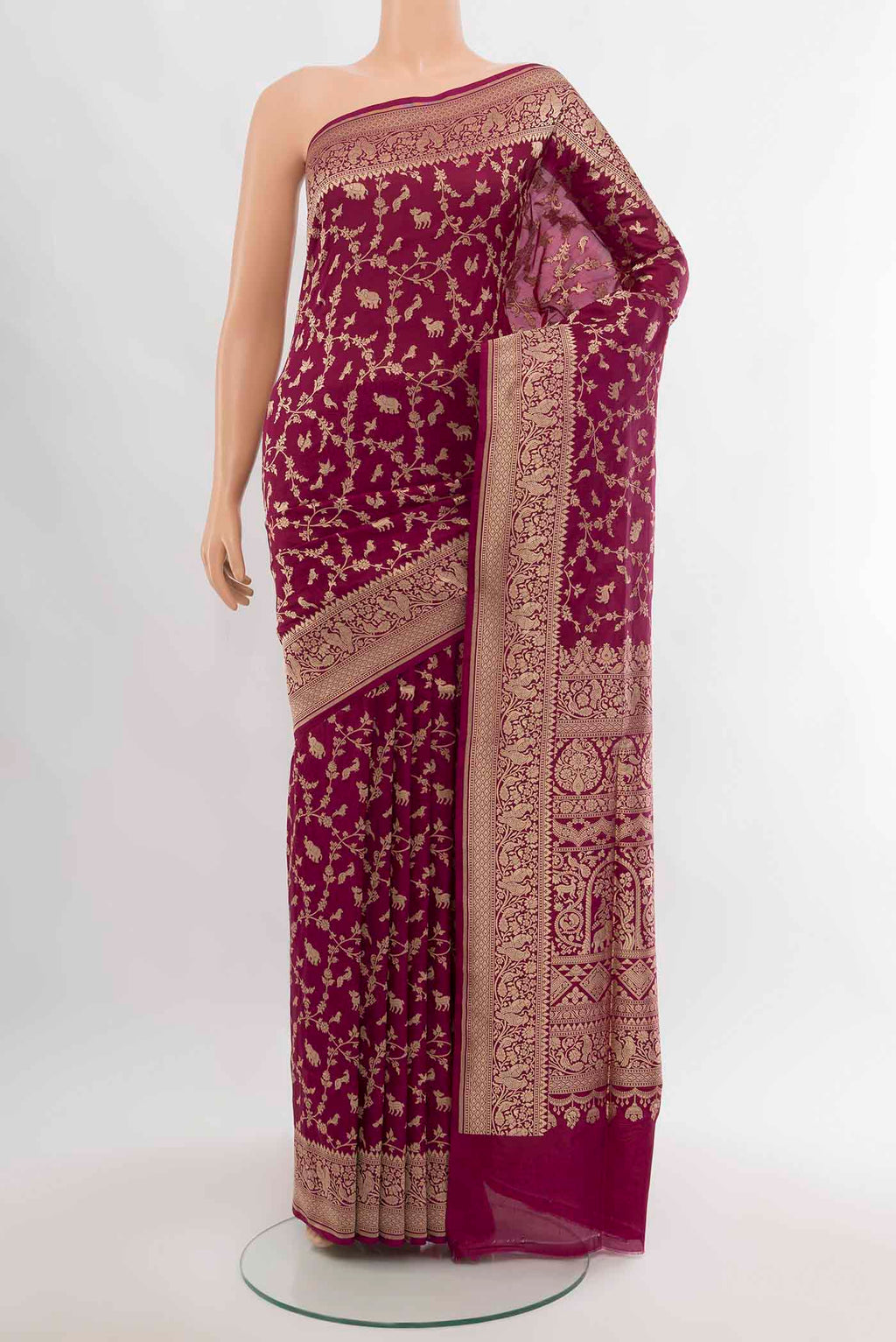 Purple Banarasi Silk Saree with Zari Butta on the body and Silk Border.  displayed on a mannequin