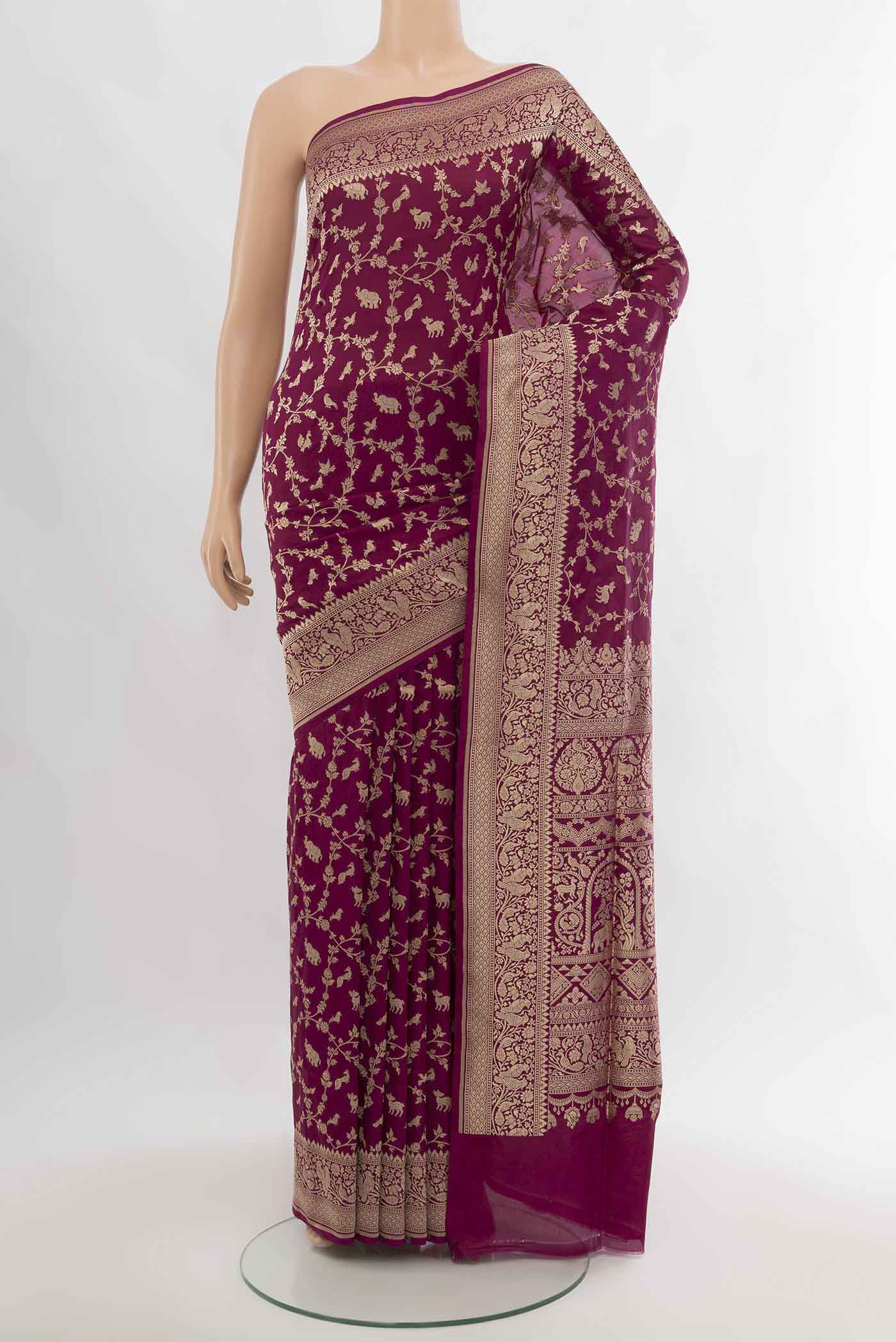 Purple Banarasi Silk Saree with Zari Butta on the body and Silk Border.  displayed on a mannequin