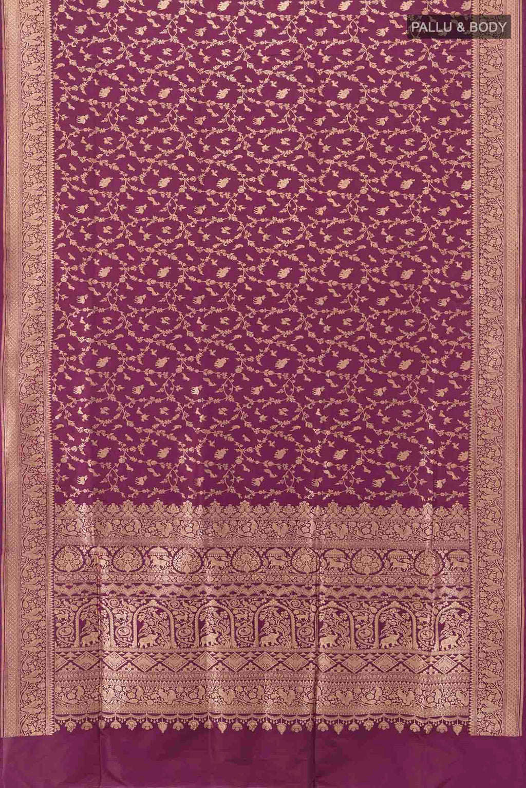 Flat view of Purple Banarasi Silk Saree with Zari Butta on the body and Silk Border. 