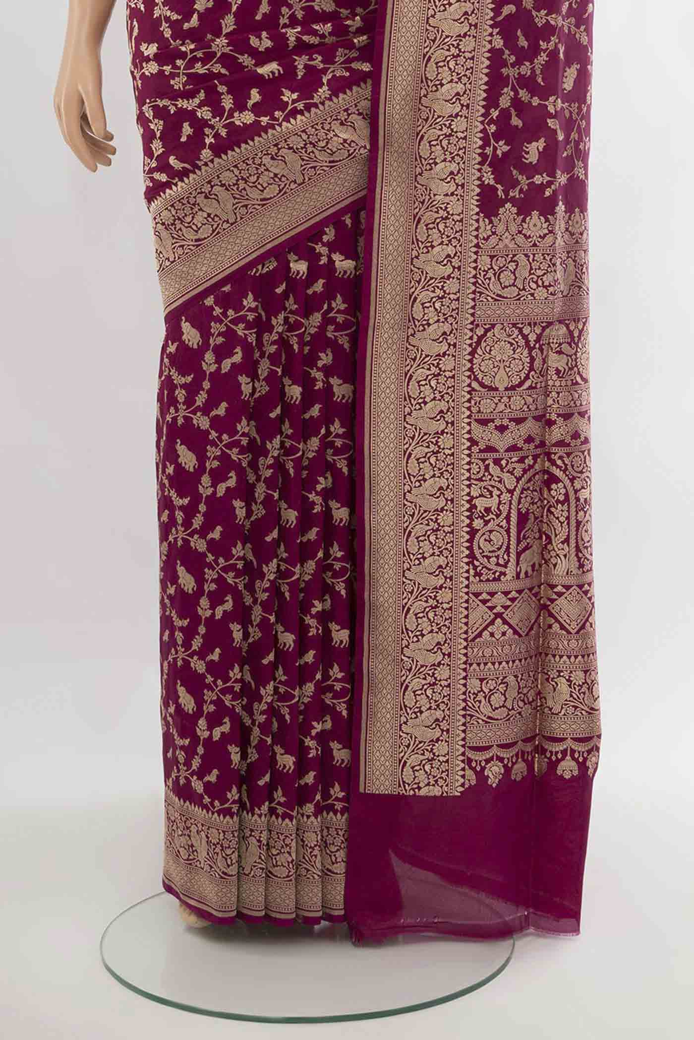 Pleats and pallu of Purple Banarasi Silk Saree with Zari Butta on the body and Silk Border. 