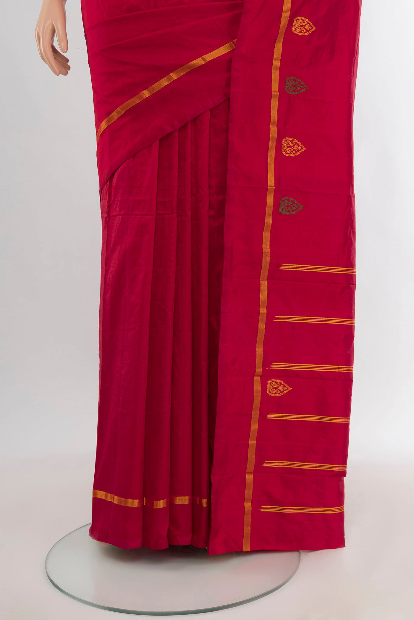 Pleats and pallu of Red Kanchipuram Silk Saree with Plain Body and Zari Border. 