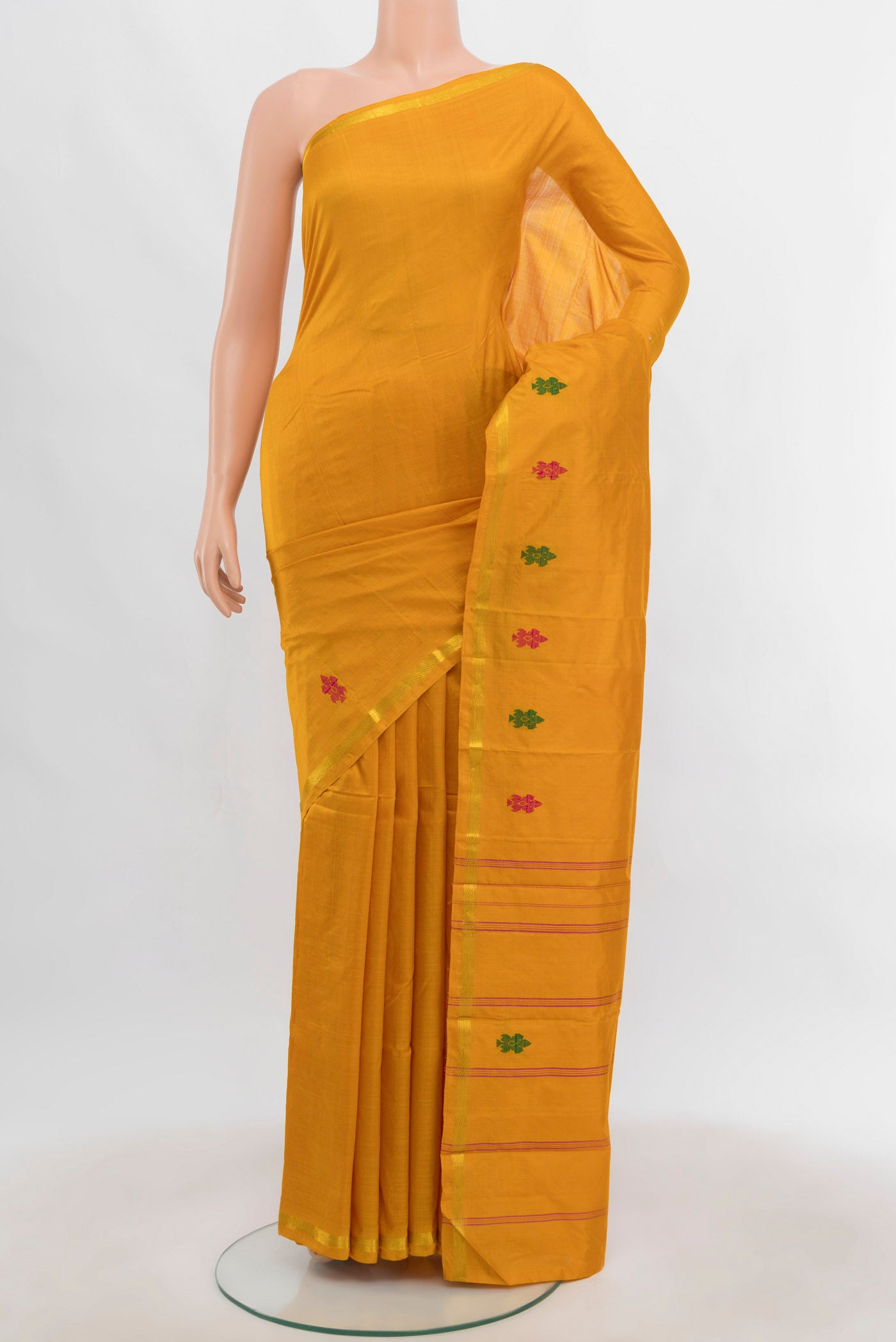 Yellow Kanchipuram Silk Saree with Zari Butta on the body and Silk Border.  displayed on a mannequin