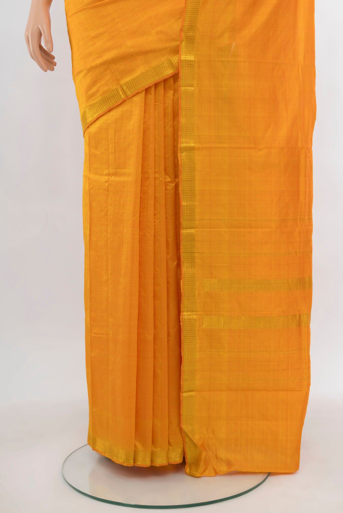 Pleats and pallu of Yellow Kanchipuram Silk Saree with Zari Butta on the body and Silk Border. 