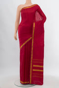 Maroon Kanchipuram Silk Saree with Plain Body and Silk Border.  displayed on a mannequin