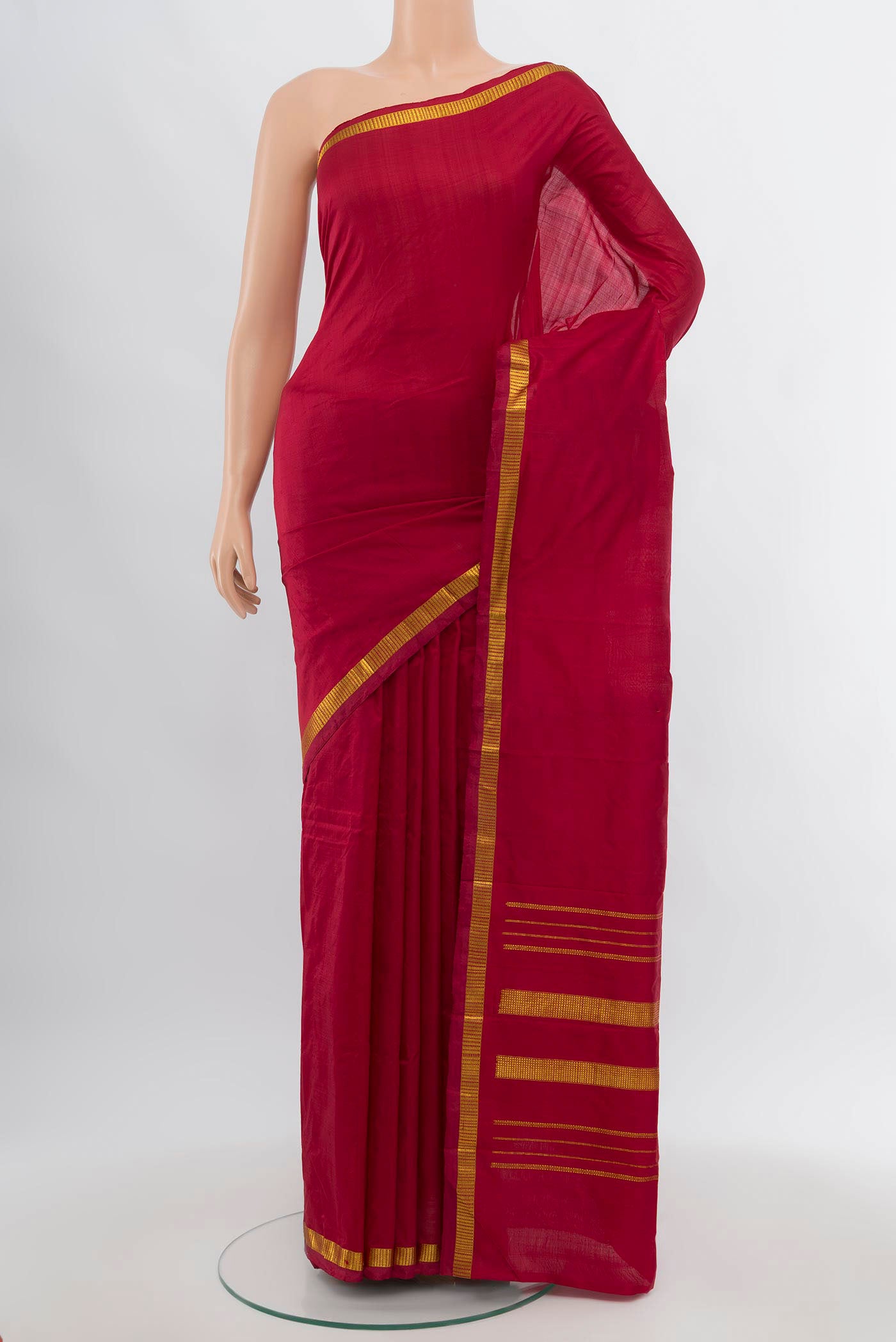 Maroon Kanchipuram Silk Saree with Plain Body and Silk Border.  displayed on a mannequin