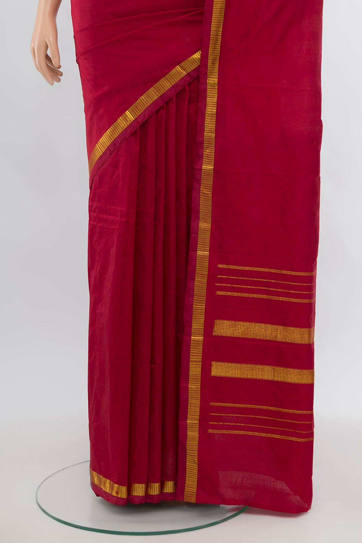 Pleats and pallu of Maroon Kanchipuram Silk Saree with Plain Body and Silk Border. 