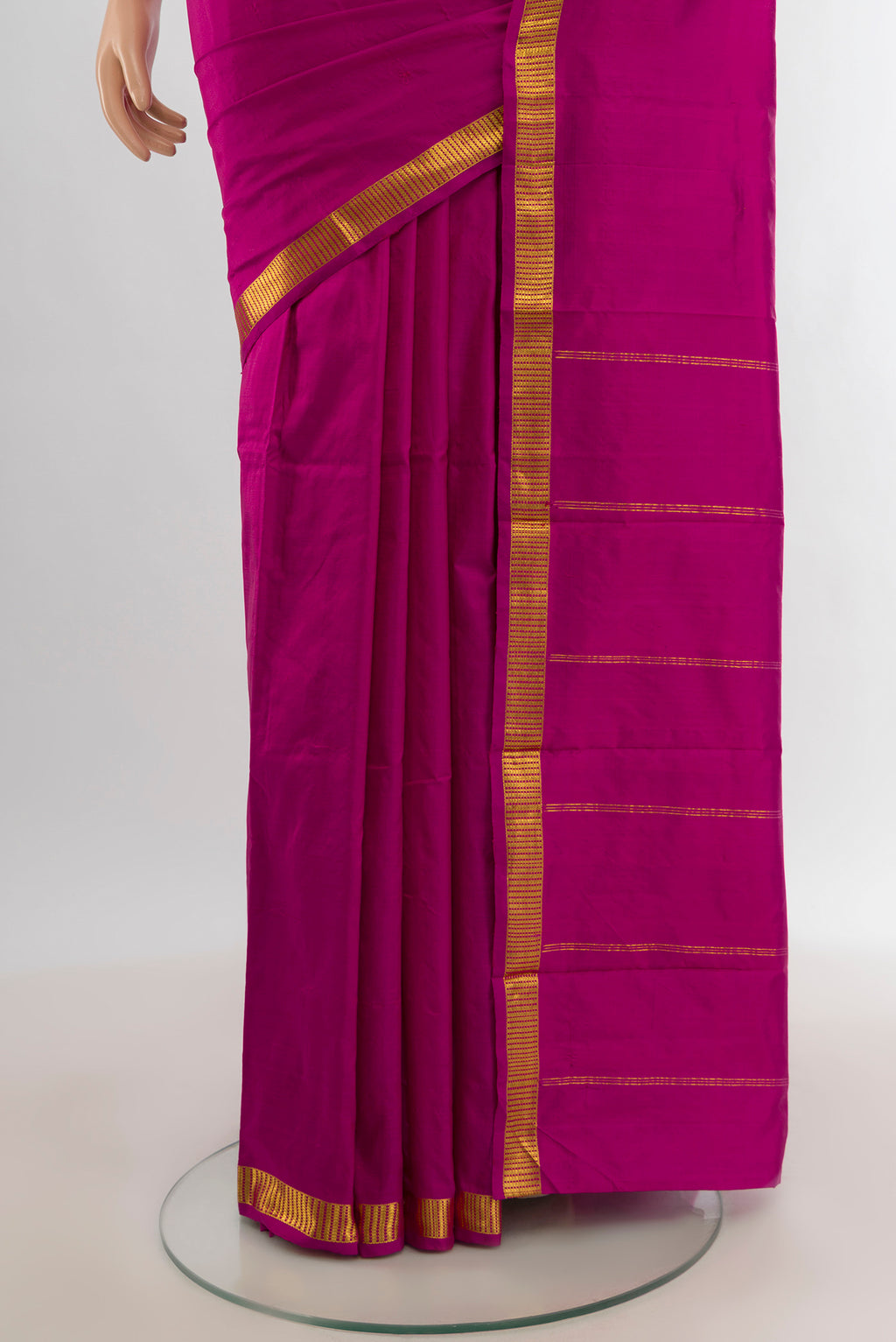 Pleats and pallu of Magenta Kanchipuram Silk Saree with Plain Body and Zari Border. 