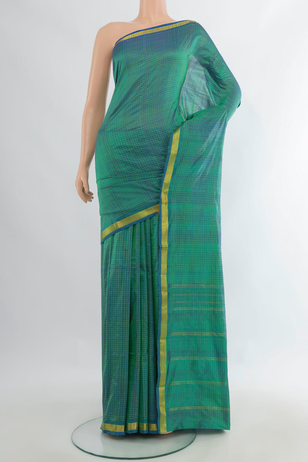 Pure Silk Sea Green Kanchipuram Saree with Checked design on the body and Zari Border.  displayed on a mannequin