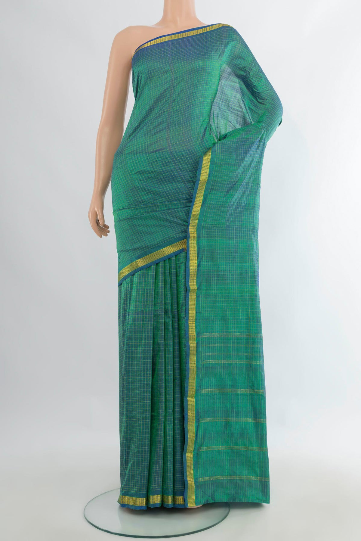 Pure Silk Sea Green Kanchipuram Saree with Checked design on the body and Zari Border.  displayed on a mannequin