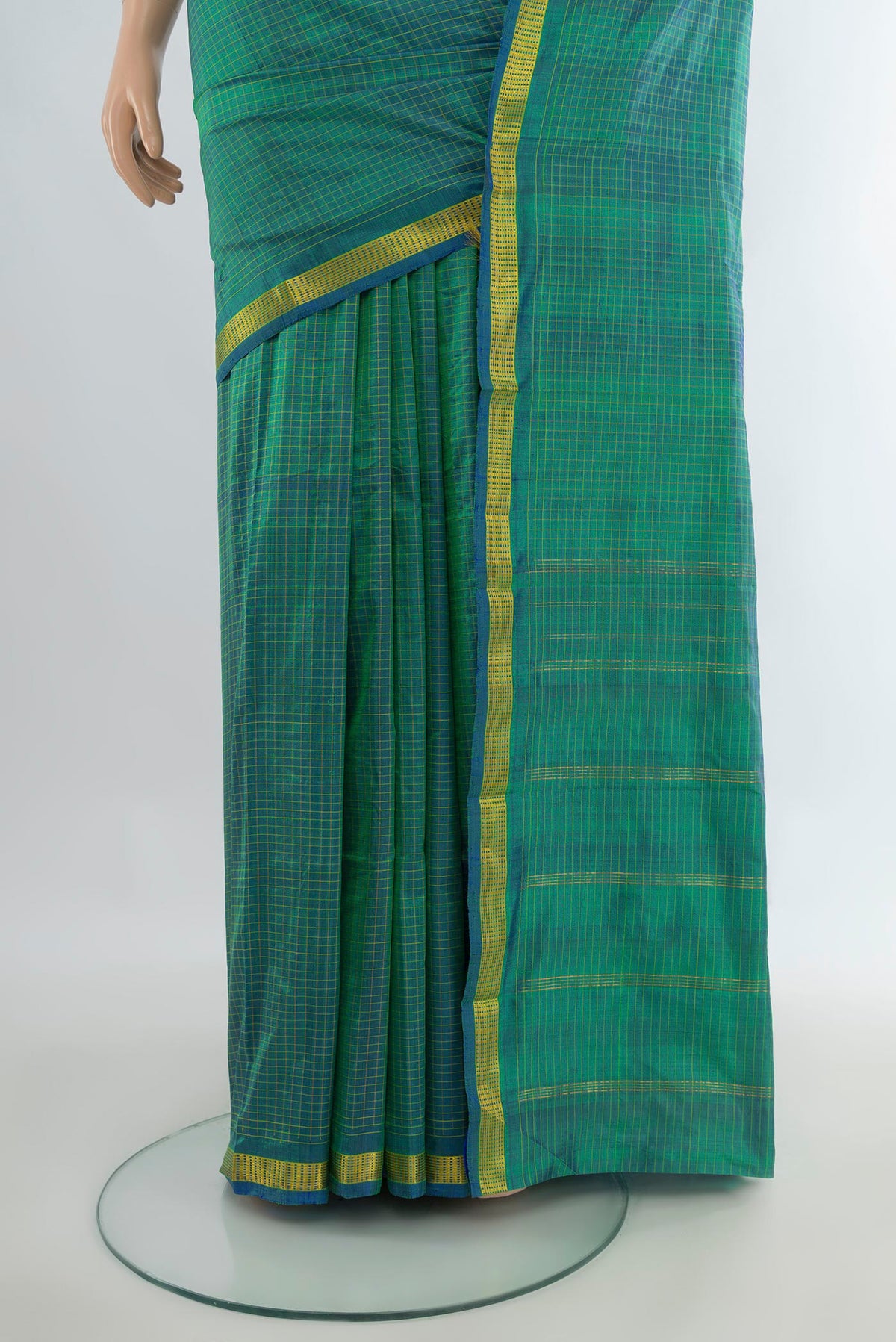 Pleats and pallu of Pure Silk Sea Green Kanchipuram Saree with Checked design on the body and Zari Border. 