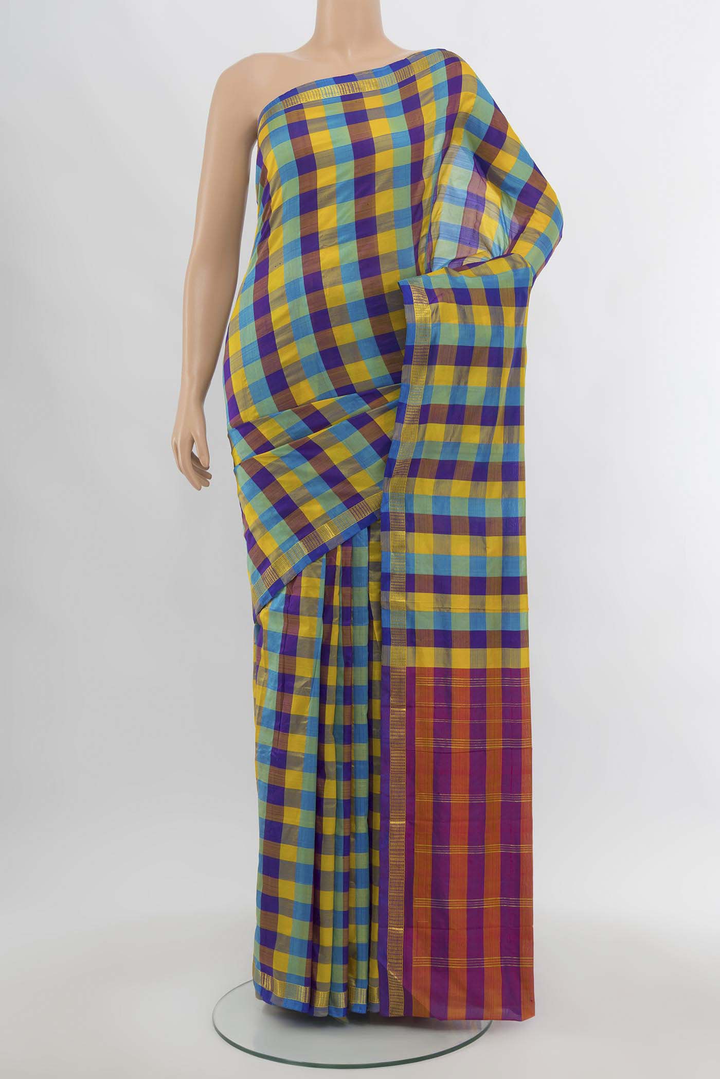 Multi Color Kanchipuram Silk Saree with Zari Butta on the body and Silk Border.  displayed on a mannequin