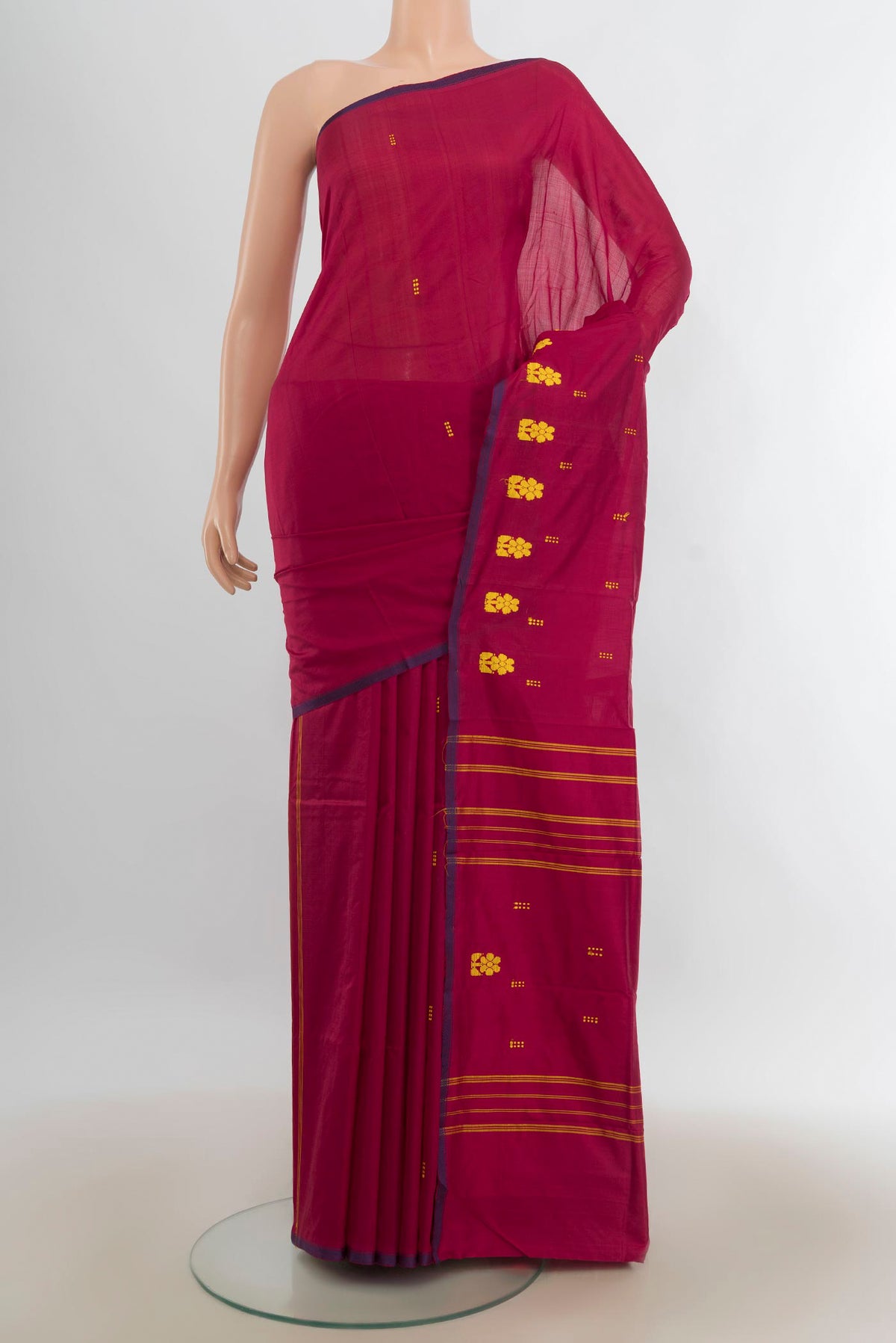 Pure Silk Maroon Kanchipuram Saree with Thread Butta on the body and Silk Border.  displayed on a mannequin