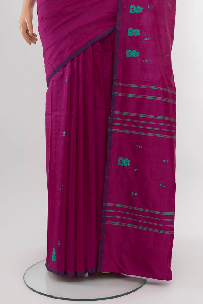 Pleats and pallu of Purple Kanchipuram Silk Saree with Thread Butta on the body and Silk Border. 