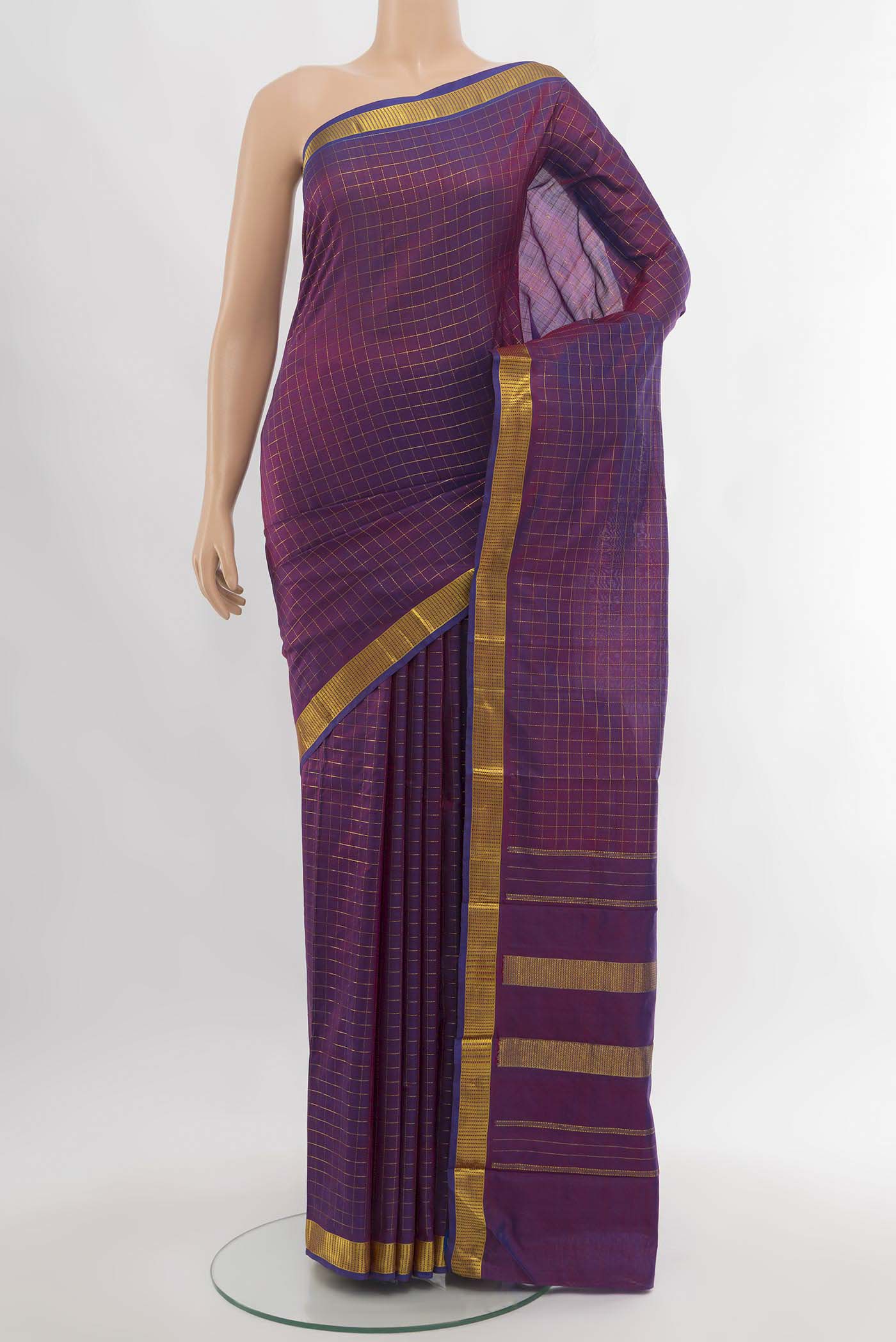 Purple Kanchipuram Silk Saree with Zari Butta on the body and Silk Border.  displayed on a mannequin