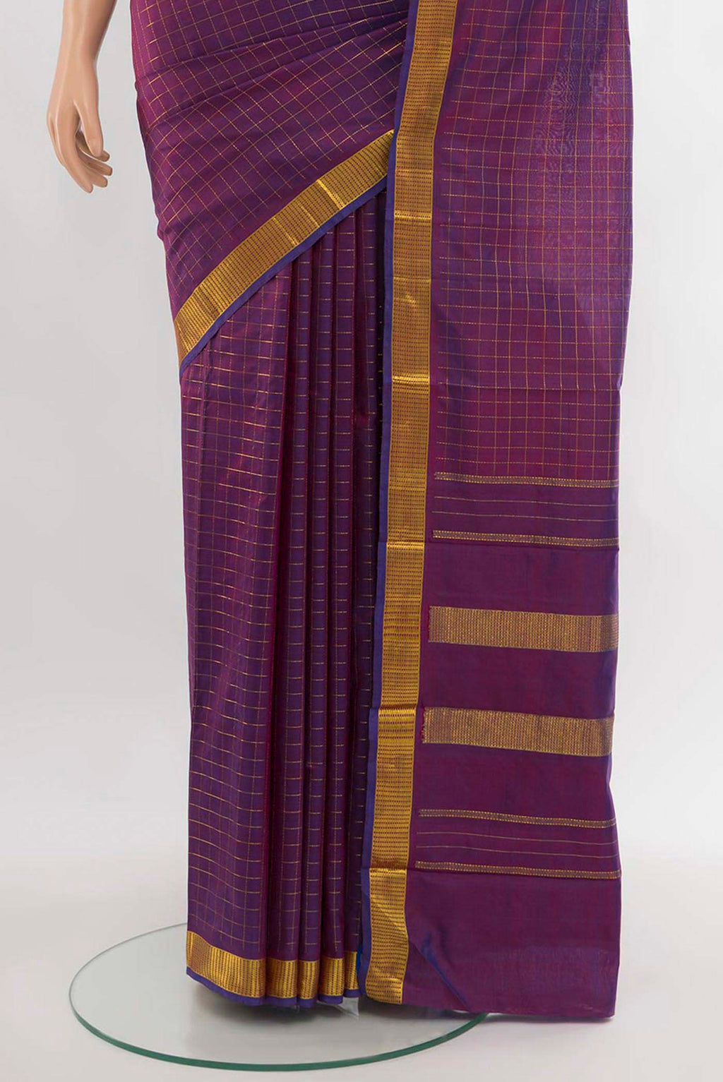 Pleats and pallu of Purple Kanchipuram Silk Saree with Zari Butta on the body and Silk Border. 