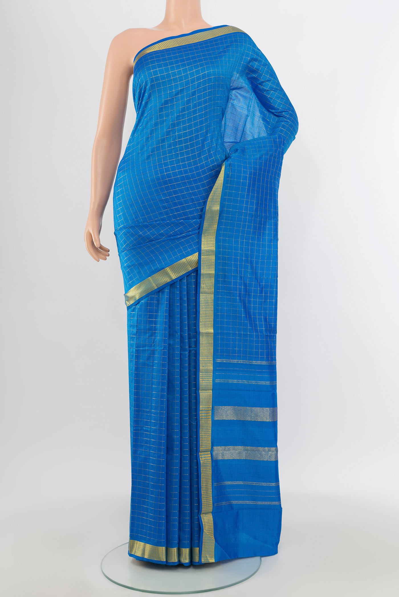 Royal Blue Kanchipuram Silk Saree with Checked design on the body and Zari Border.  displayed on a mannequin