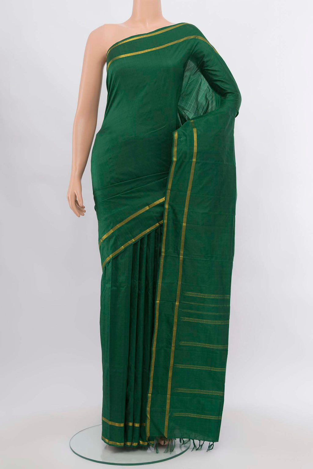 Bottle Green Kanchipuram Silk Saree with Plain Body and Silk Border.  displayed on a mannequin