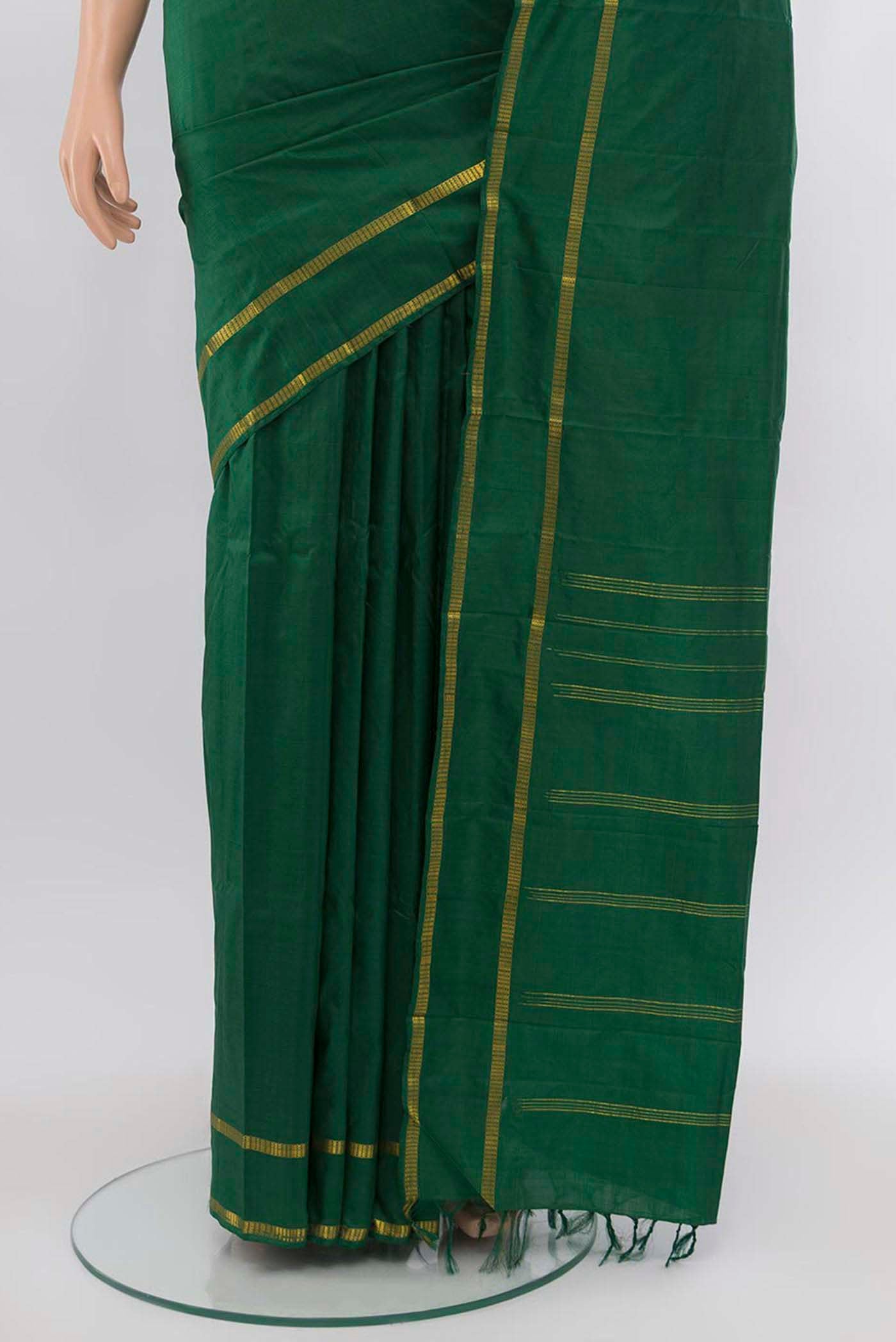 Pleats and pallu of Bottle Green Kanchipuram Silk Saree with Plain Body and Silk Border. 
